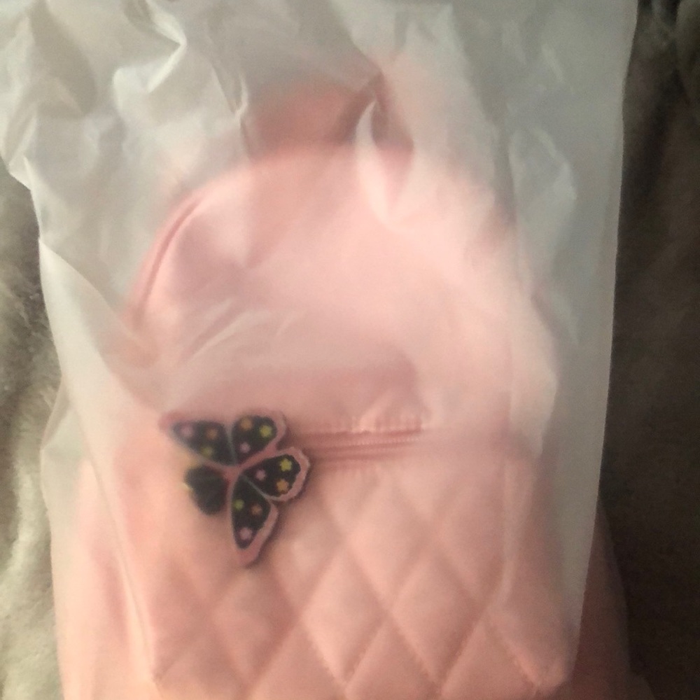 Brand new still in bag backpack with charm